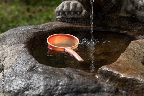 floating bucket at the fountain photo