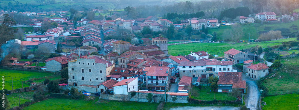 Naklejka premium Winter landscape of the town of Santillana del Mar at dusk seen from a drone. Municipality of Santillana del Mar. Community of Cantabria. Spain. Europe
