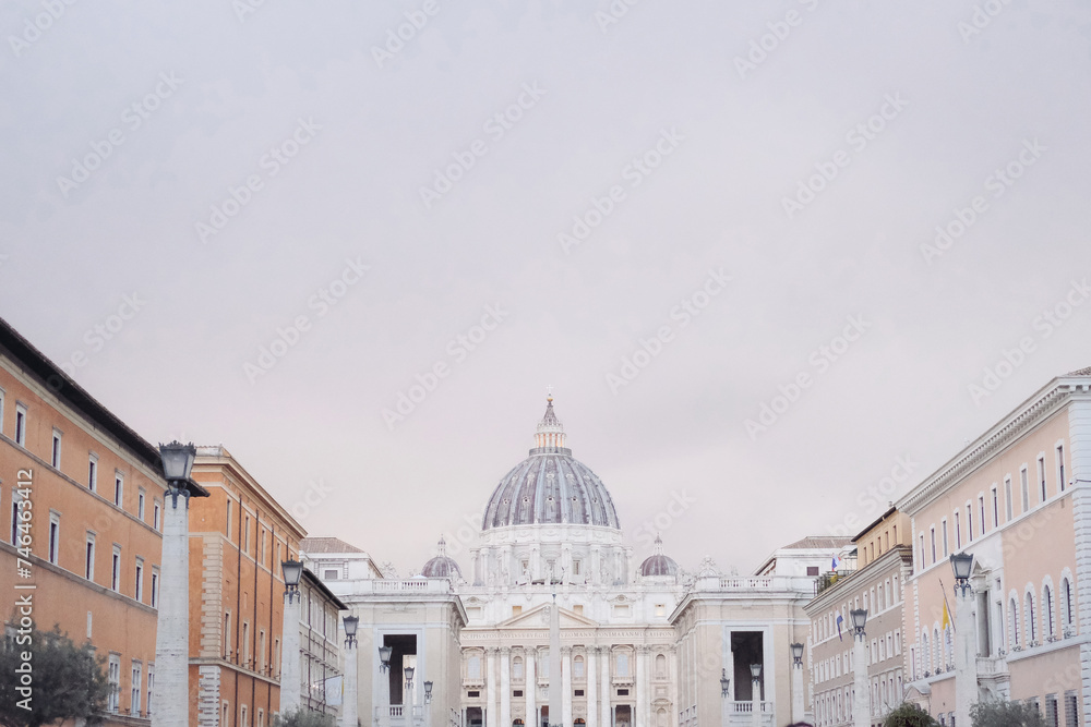 St. Peter's Basilica during the sunset, grey sky with pink colors 