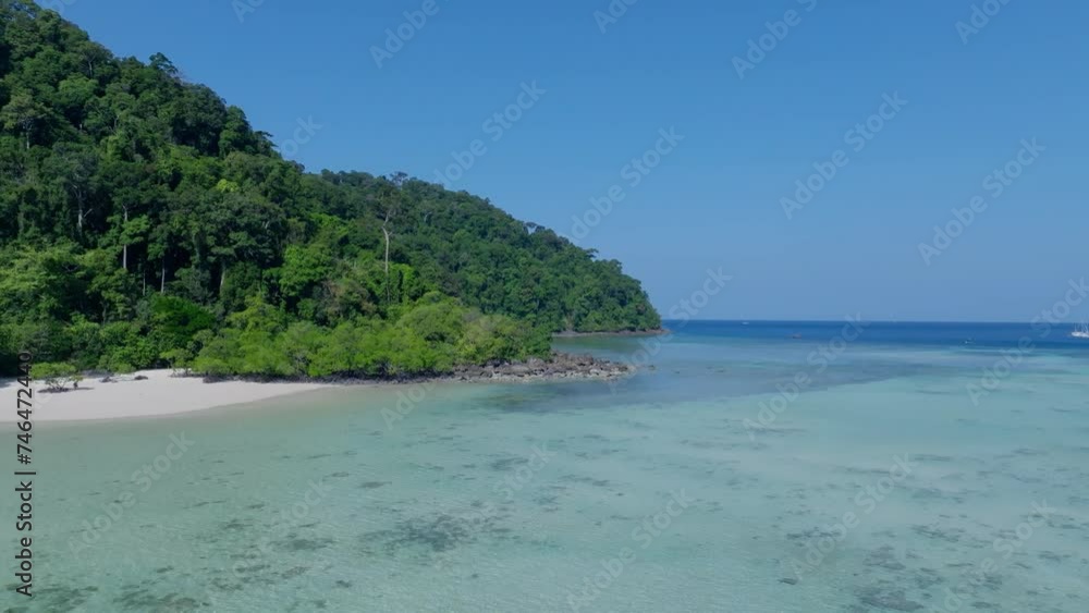 The tropical island with blue water as white beach natural island scene The tropical island with blue water as white beach natural island scene