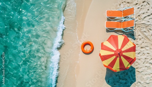 Top view of beach chairs and umbrella for summer vacation concept. Relaxing beach scene.