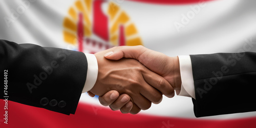 Businessman, diplomat in suits clasp hands for handshake over French Polynesia flag, agree on united success in trade, diplomacy, cooperation, negotiation, teamwork in commerce, gesture of greeting