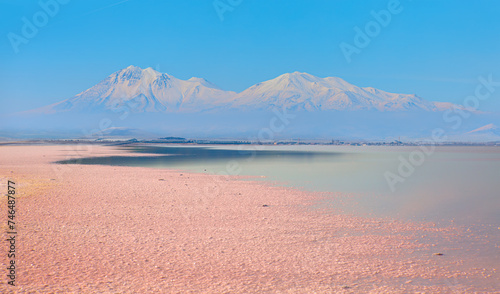 Beautiful landscape with pink salt Snowy mountains in the background  photo