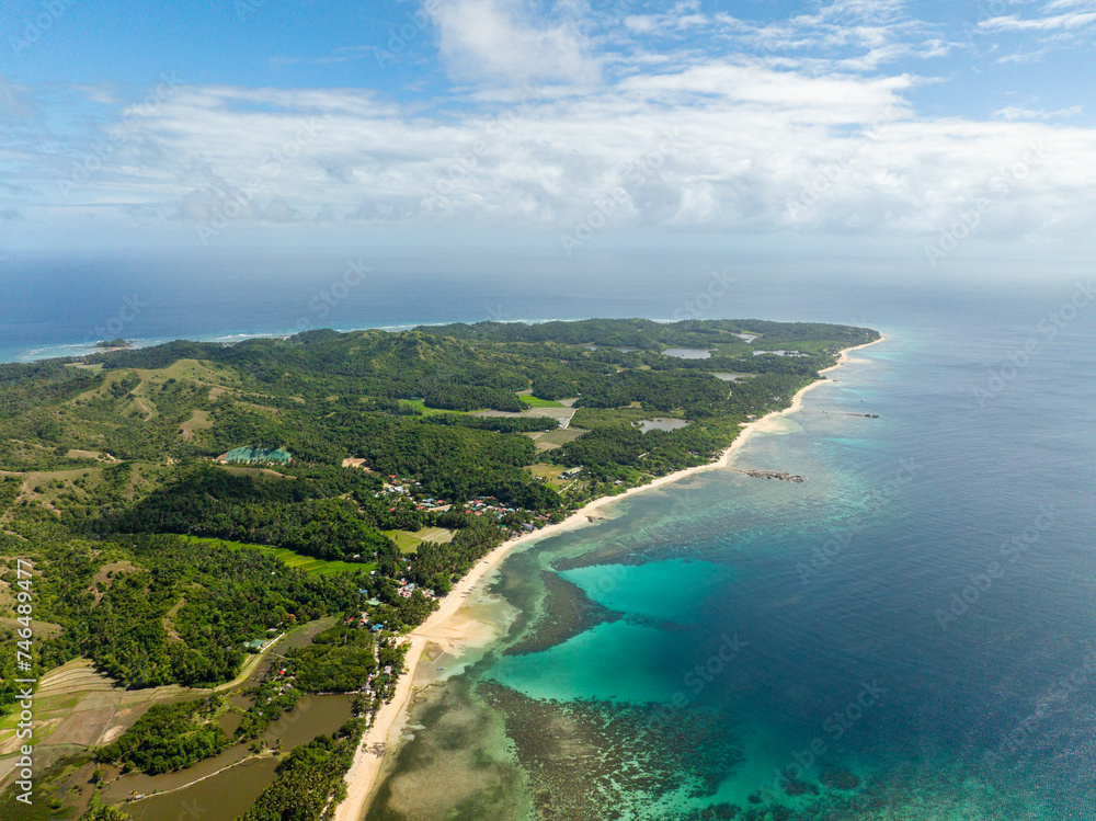 Tropical landscape of coastline with white sand and turquoise sea water. Santa Fe, Tablas, Romblon. Philippines.