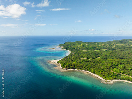 Turquoise sea water with corals in tropical beaches. Santa Fe, Tablas, Romblon. Philippines.