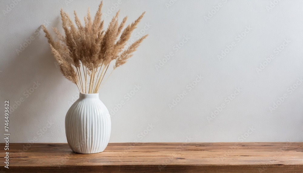 modern white ceramic vase with dry grass on wooden table scandinavian interior empty white wall copy space - obrazy, fototapety, plakaty 