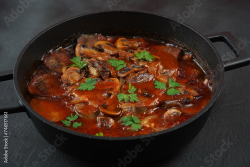 Slowly stewed beef tongue with mushrooms and onions