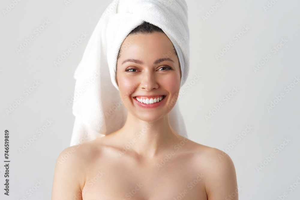 The most beautiful woman is standing in the bathroom, she has a towel on her head, The woman is smiling mischievously. a beautiful white-toothed smile. A light photo with a white background The most beautiful woman is standing in the bathroom, she has a towel on her head, The woman is smiling mischievously. a beautiful white-toothed smile. A light photo with a white background