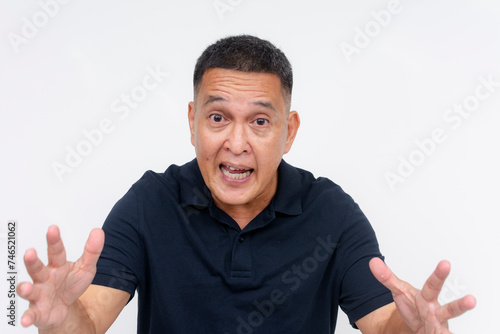 An exasperated middle aged man looks frustrated and upset while explaining or arguing, isolated on a white background.