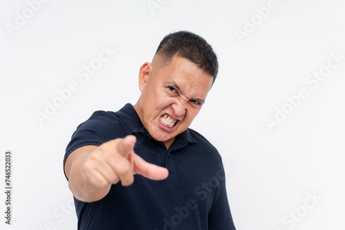 A resentful middle aged man snarling and blaming someone for his failures. Isolated on a white background.