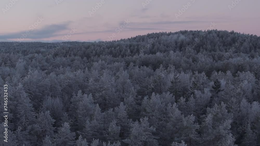 Sunrise over a frozen forest covered by snow and ice captured with drone. Original file quality, 4K, DLOG, ProRes HQ. Sunrise over a frozen forest covered by snow and ice captured with drone. Original file quality, 4K, DLOG, ProRes HQ.