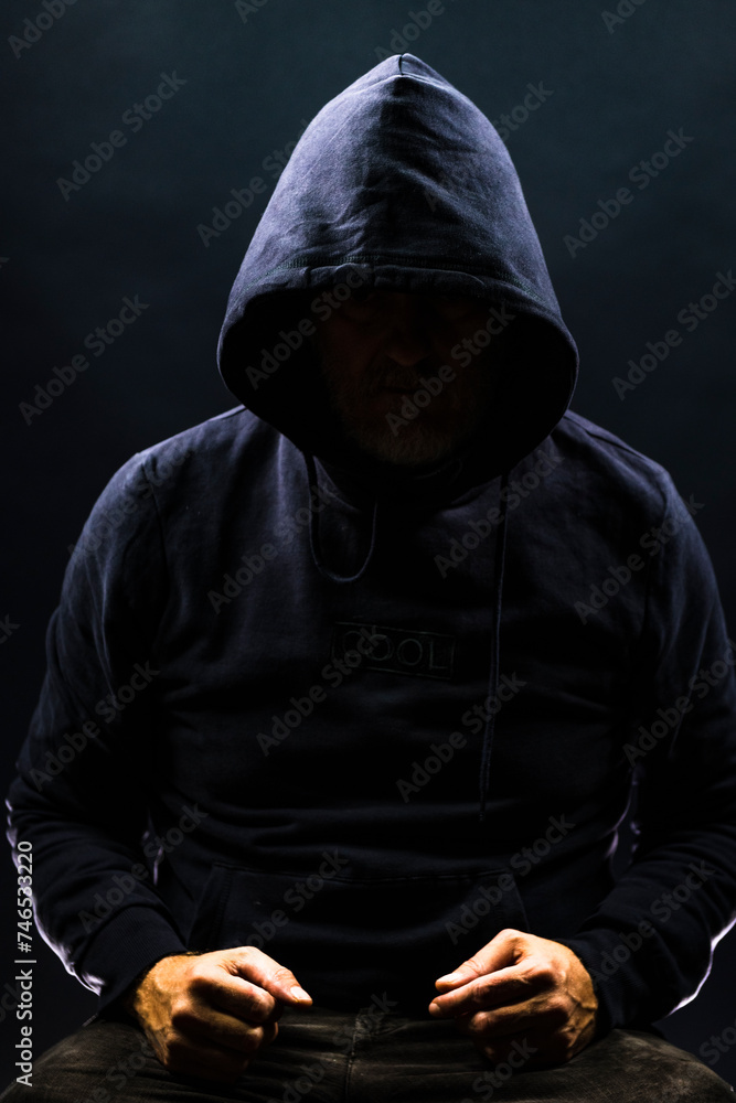 a shady figure that could represent a criminal, a hacker, ambiguity and duplicity