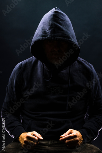 Obraz na płótnie a shady figure that could represent a criminal, a hacker, ambiguity and duplicity w salonie