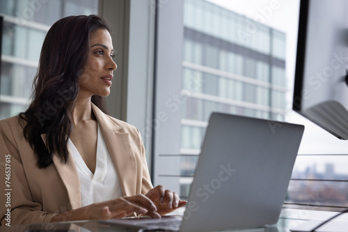 Successful businesswoman working in the financial industry photo