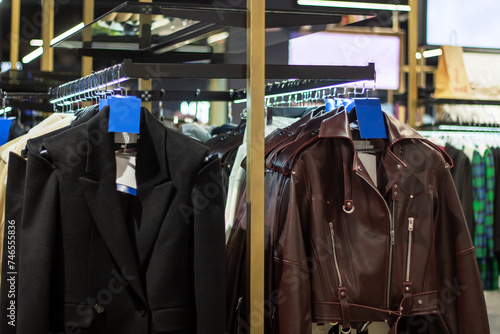 Jackets on hangers in a shop window