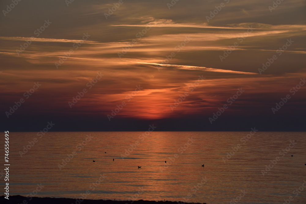 sunset over the sea horizon