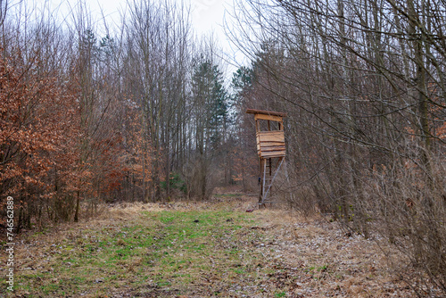 A hunter's hide is hidden in a bush in the forest in Siebenbrunn