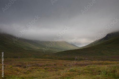 View of the Glencoe mountains on a day with dramatic skies from Glencoe viewpoint © casavella