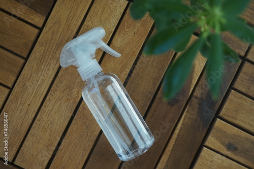 spray bottle for spraying plants on a wooden background