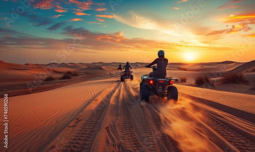 An off road ATV driving dune bashing in breathtaking view desert area at sunset or sunrise