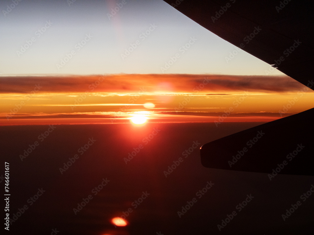 Majestic Sunset View from Airplane Wing at High Altitude Majestic Sunset View from Airplane Wing at High Altitude