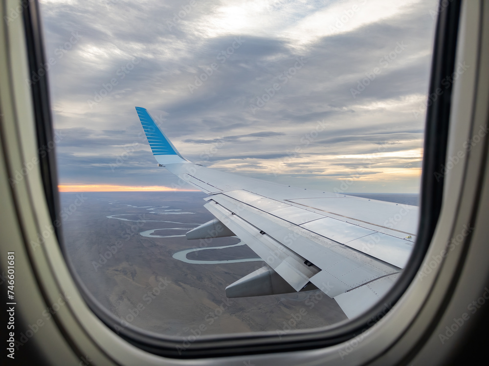 Scenic Aerial View of a Sunset from an Airplane Window Scenic Aerial View of a Sunset from an Airplane Window