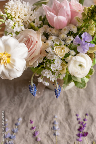 Fototapeta Naklejka Na Ścianę i Meble -  a beautiful delicate spring bouquet of tulips, buttercups and muscari, floral arrangement	
