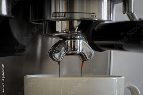 Close-up of espresso pouring from coffee machine
