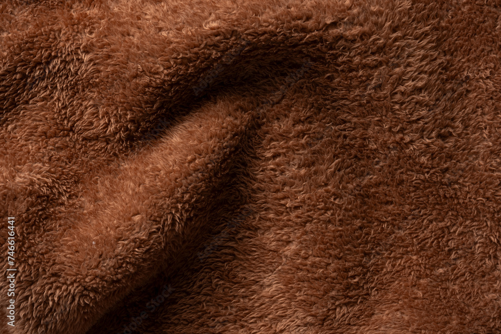 Fototapeta premium Texture of a brown faux fur as a background.
