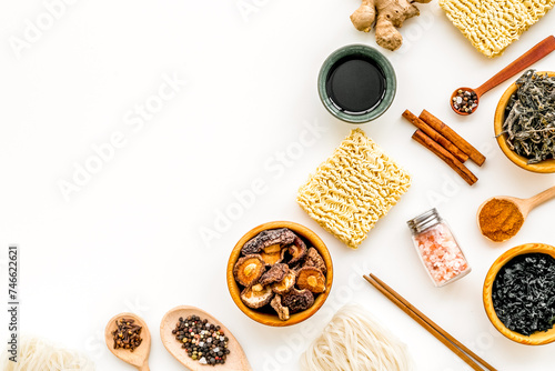 Geometric design with Chinese, Japanese products, noodles, weeds, spices, mushrooms on white background top view mockup photo