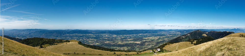Panorama from Grand Colombier summit (France) on a clear summer day, looking westward showing the Valromey plateau and valley