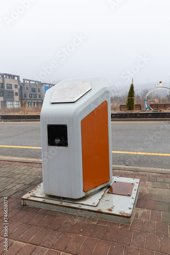 Recycling point outdoor in the city street. Self service machine to receive used plastic bottles and cans on a city street photo