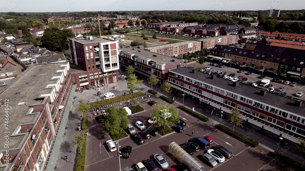 Shopping area aerial in residential neighbourhood Waterkwartier in suburbs of Zutphen. City planning, street plan, infrastructure and urban development concept seen from above.