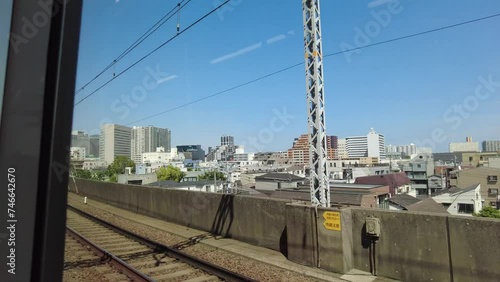 View to see the city froView of the city from inside a moving train