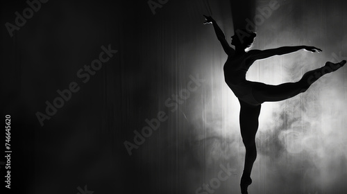 A ballerina is executing a breathtaking trick in mid-air, showcasing strength and grace in her movement