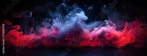 Neon smoke on room floor.  Neon fairytale smoke moves on black background. Panoramic view of the abstract fog. Swirling cloudiness, mystery mist or smog rolling low across the ground. © Shaman4ik