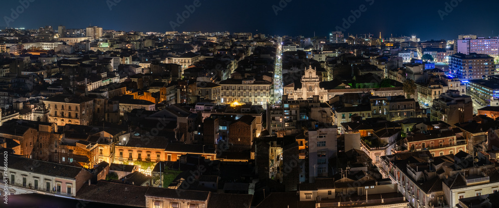 Night aerial view from the center to the sea of the city of Catania, Sicily, Italy