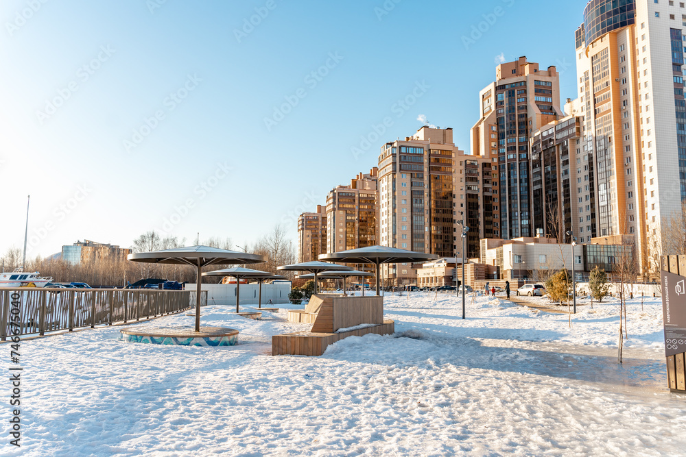 Cozy urban environment in a residential area on a sunny winter day with benches