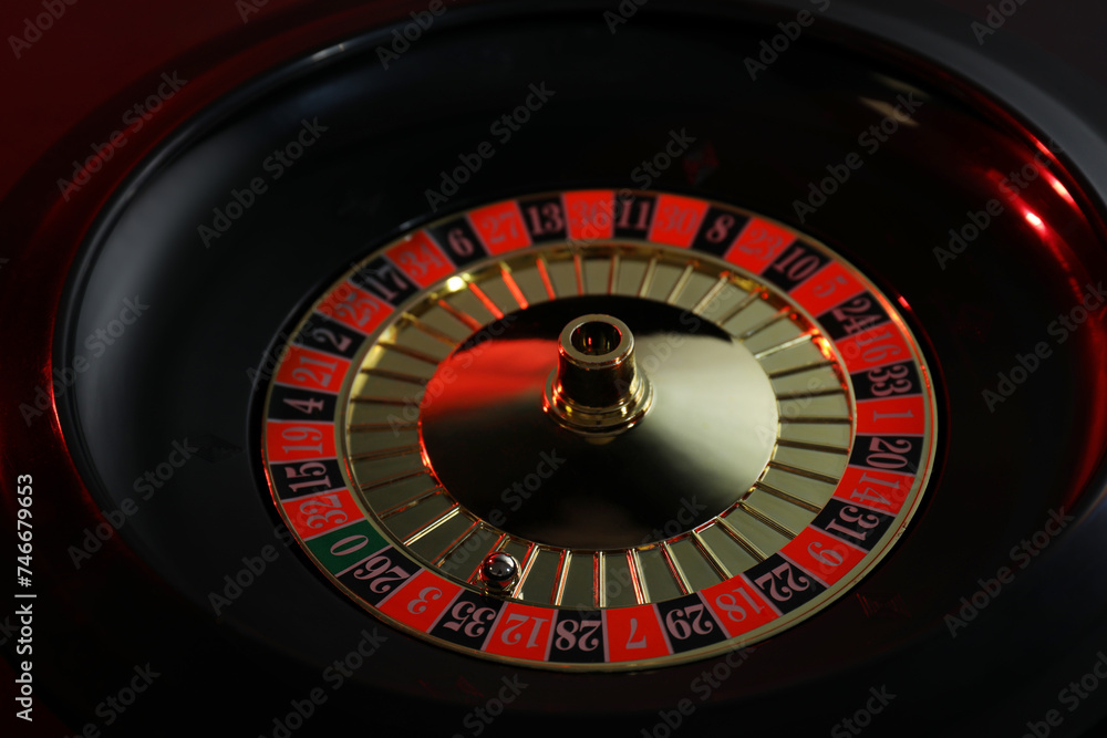 Roulette wheel with ball on black table, closeup. Casino game Roulette wheel with ball on black table, closeup. Casino game