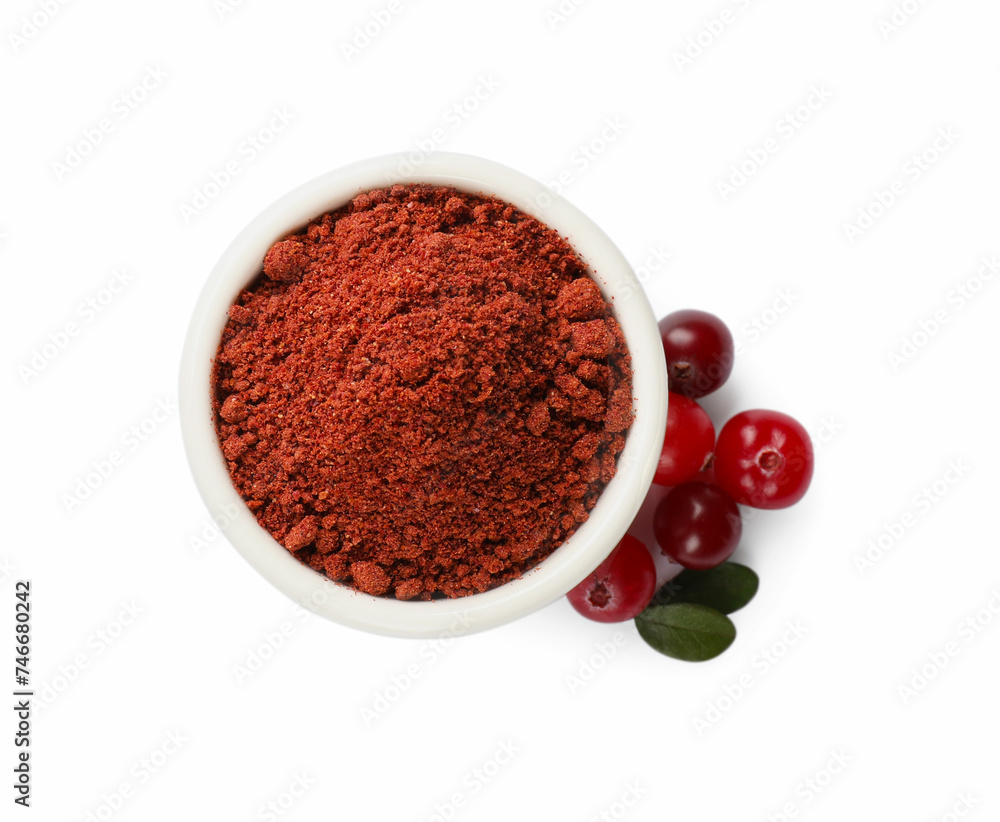 Dried cranberry powder in bowl, fresh berries and green leaves isolated on white, top view Dried cranberry powder in bowl, fresh berries and green leaves isolated on white, top view