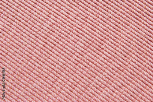 Soft pink color ribbed jersey fabric pattern close up as background