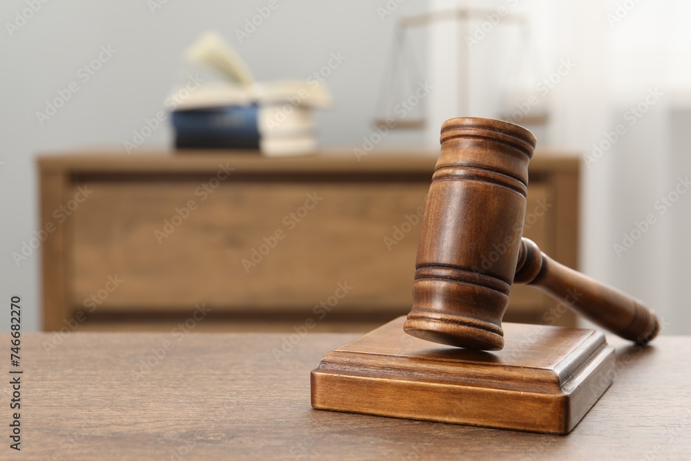 Wooden gavel and sound block on table indoors, closeup. Space for text Wooden gavel and sound block on table indoors, closeup. Space for text