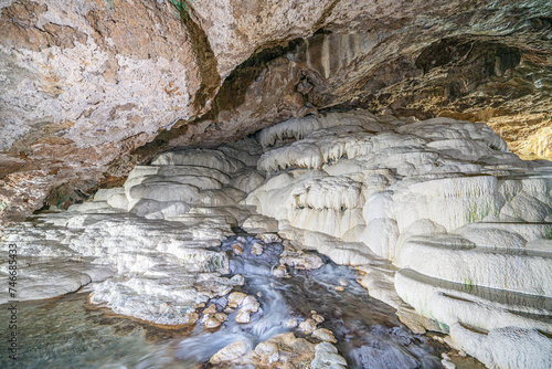 The scenic views of Kaklık cave which is full of dripstones, stalactites and stalagmites. There are also travertine formations and a small thermal lake at the bottom of the cave in Denizli, Turkey