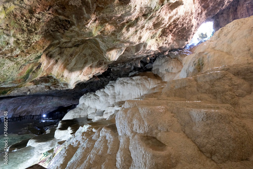 The scenic views of Kaklık cave which is full of dripstones, stalactites and stalagmites. There are also travertine formations and a small thermal lake at the bottom of the cave in Denizli, Turkey photo