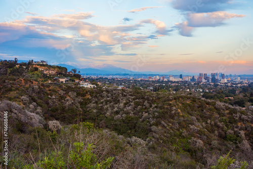 Looking out towards downtown Los Angeles and the snow covered San Gabriel Mountains. Pictures taken during sunset in the Santa Monica Mountains. photo