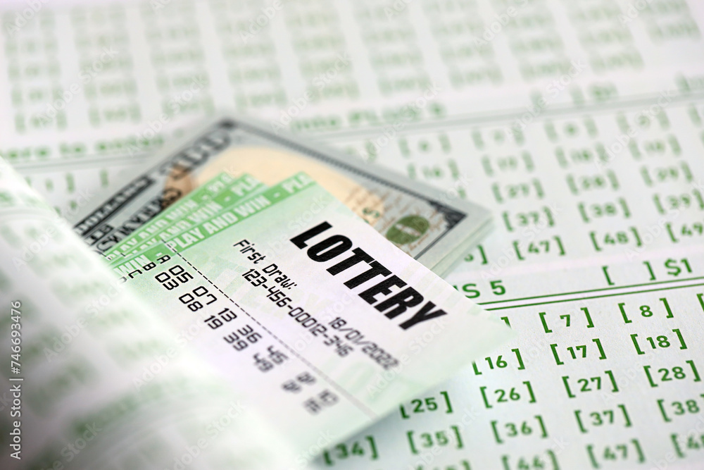 Green lottery tickets and US money bills on blank with numbers for playing lottery close up Green lottery tickets and US money bills on blank with numbers for playing lottery close up