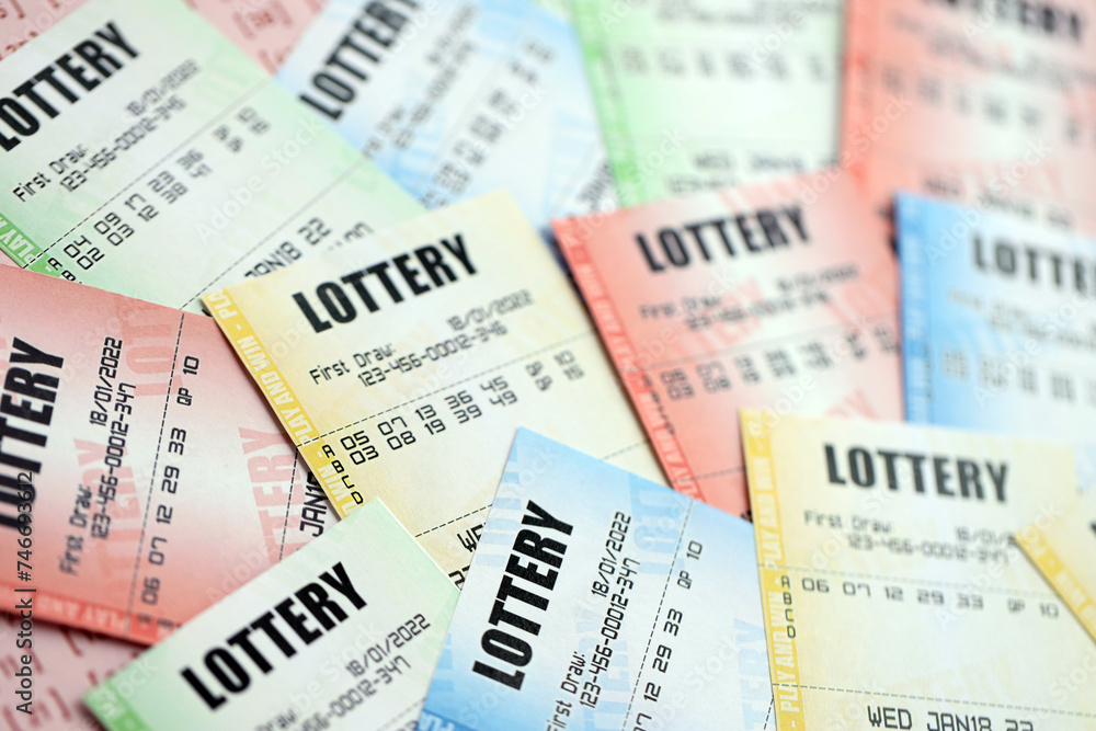 Many lottery tickets on blank bills with numbers for playing lottery close up Many lottery tickets on blank bills with numbers for playing lottery close up