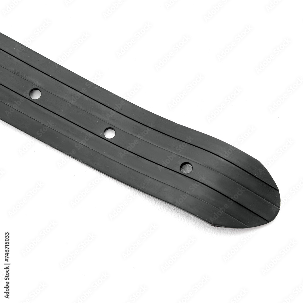 Black rubber belt for spearfishing on white background. Holes in the belt closeup Black rubber belt for spearfishing on white background. Holes in the belt closeup