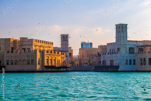 Canvas Print Sunset Glow on Traditional Wind Towers Along Dubai Creek