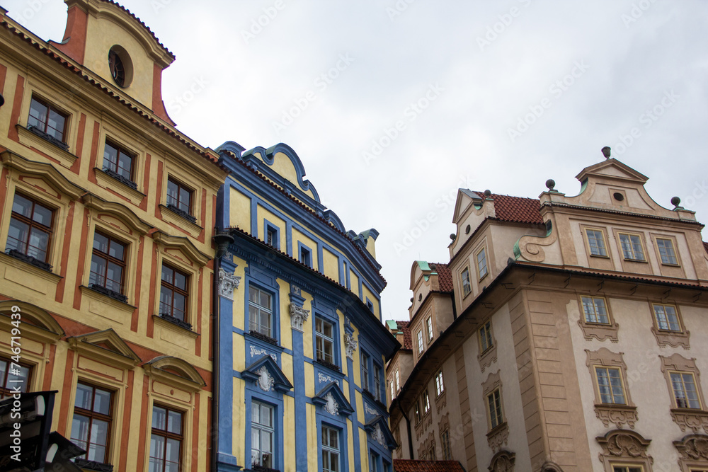 Colorful houses in the old historical part of Prague against the background of clouds